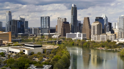 DXP002_103_0005 - Aerial stock photo of Towering skyscrapers in Downtown Austin, Texas seen from the shore of Lady Bird Lake