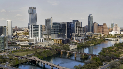 DXP002_104_0002 - Aerial stock photo of Towering city skyscrapers, and bridges spanning Lady Bird Lake, Downtown Austin, Texas