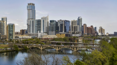 DXP002_104_0005 - Aerial stock photo of Bridges over Lady Bird Lake near waterfront skyscrapers, Downtown Austin, Texas