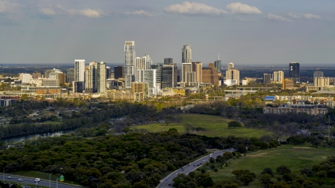 DXP002_104_0008 - Aerial stock photo of A wide view of city's towering skyline and the shore of Lady Bird Lake, Downtown Austin, Texas