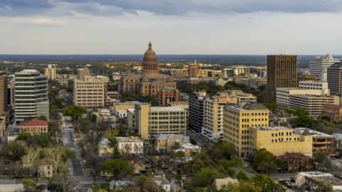 DXP002_104_0012 - Aerial stock photo of A view of the Texas State Capitol building at sunset in Downtown Austin, Texas