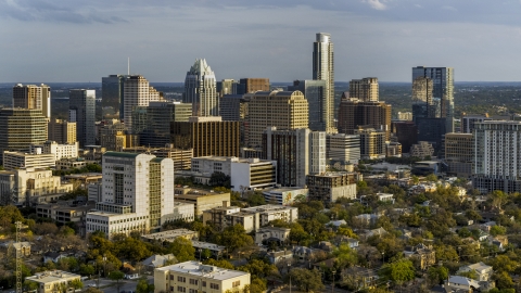 DXP002_104_0016 - Aerial stock photo of A courthouse, office buildings, and skyscrapers at sunset in Downtown Austin, Texas