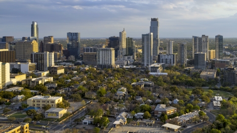 DXP002_105_0001 - Aerial stock photo of A view of skyscrapers at sunset with clouds in the sky in Downtown Austin, Texas