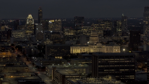 DXP002_106_0001 - Aerial stock photo of Office buildings, skyscrapers and capitol at night in Downtown Austin, Texas