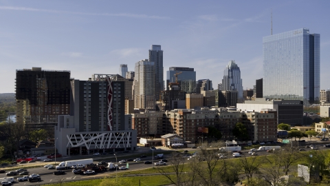 DXP002_108_0012 - Aerial stock photo of A view of tall city skyscrapers and high-rise hotel in Downtown Austin, Texas