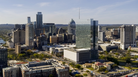 DXP002_108_0016 - Aerial stock photo of A hotel and the city's skyline in Downtown Austin, Texas