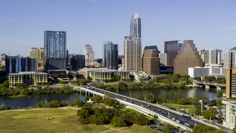 DXP002_109_0002 - Aerial stock photo of A view of the city's skyline across Lady Bird Lake seen from a bridge, Downtown Austin, Texas