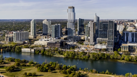 DXP002_109_0008 - Aerial stock photo of A modern skyscraper across Lady Bird Lake, Downtown Austin, Texas