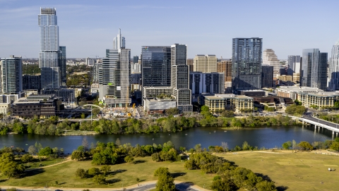 DXP002_109_0011 - Aerial stock photo of The Northshore skyscraper on the other side of Lady Bird Lake, Downtown Austin, Texas