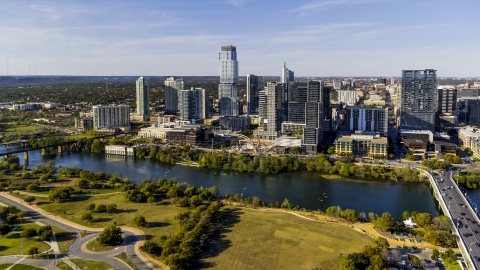 DXP002_109_0014 - Aerial stock photo of Skyscrapers in the city's waterfront skyline on the other side of Lady Bird Lake, Downtown Austin, Texas