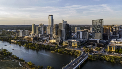 DXP002_110_0001 - Aerial stock photo of A view of the city's waterfront skyline and Lady Bird Lake at sunset in Downtown Austin, Texas