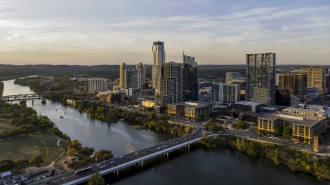 DXP002_110_0002 - Aerial stock photo of The city's waterfront skyline and Lady Bird Lake at sunset in Downtown Austin, Texas