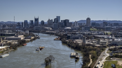 A barge on the river and the city's skyline, Downtown Nashville, Tennessee Aerial Stock Photos | DXP002_112_0007