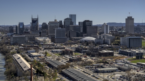 The city's riverfront skyline, seen from the side of the river, Downtown Nashville, Tennessee Aerial Stock Photos | DXP002_113_0001