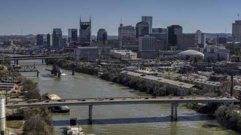 Skyscrapers in the city's skyline, seen from a bridge over the river, Downtown Nashville, Tennessee Aerial Stock Photos | DXP002_113_0003