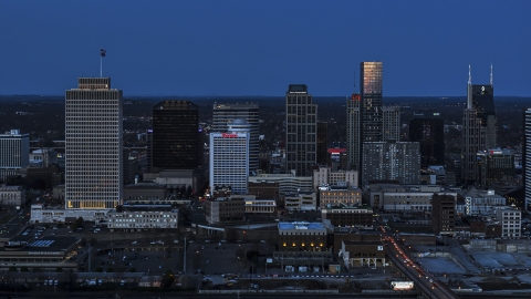 A view of skyscrapers reflecting light in the city skyline at twilight in Downtown Nashville, Tennessee Aerial Stock Photos | DXP002_115_0006