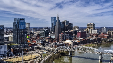 A view of the AT&T Building and a bridge over the river in Downtown Nashville, Tennessee Aerial Stock Photos | DXP002_116_0002