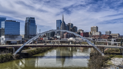 DXP002_116_0005 - Aerial stock photo of Korean War Veterans Memorial Bridge and skyscrapers in the background in Downtown Nashville, Tennessee