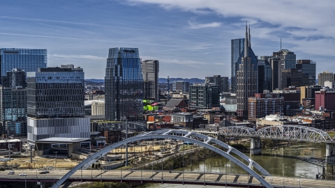 DXP002_116_0014 - Aerial stock photo of A view of the AT&T Building seen from near a bridge spanning the river in Downtown Nashville, Tennessee