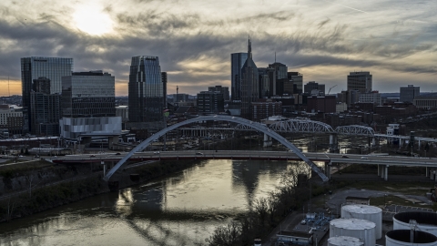 The city's skyline and bridges over the Cumberland River at sunset, Downtown Nashville, Tennessee Aerial Stock Photos | DXP002_119_0007