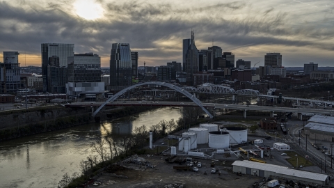 City skyline by bridges and Cumberland River at sunset, Downtown Nashville, Tennessee Aerial Stock Photos | DXP002_119_0008