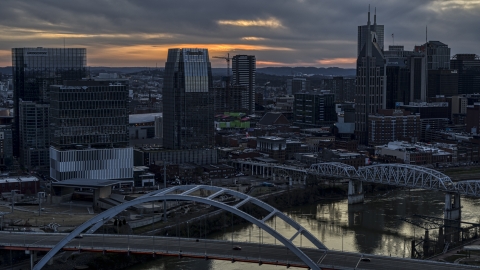 The Pinnacle skyscraper and a bridges on the river at sunset, Downtown Nashville, Tennessee Aerial Stock Photos | DXP002_120_0010