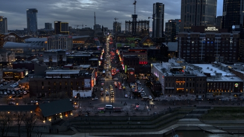 DXP002_120_0012 - Aerial stock photo of Buildings, cars and pedestrians around Broadway at twilight, Downtown Nashville, Tennessee