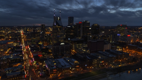 The AT&T Building skyscraper and city skyline at twilight, Downtown Nashville, Tennessee Aerial Stock Photos | DXP002_121_0005