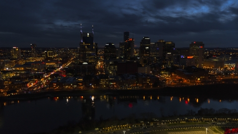 Tthe AT&T Building and skyline at twilight on the other side of the river, Downtown Nashville, Tennessee Aerial Stock Photos | DXP002_121_0009