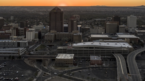 Office tower and shorter hotel tower behind convention center at sunset, Downtown Albuquerque, New Mexico Aerial Stock Photos | DXP002_122_0011