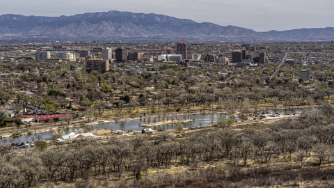 DXP002_124_0003 - Aerial stock photo of A wide view of high-rise office buildings seen from Tingley Beach, Downtown Albuquerque, New Mexico