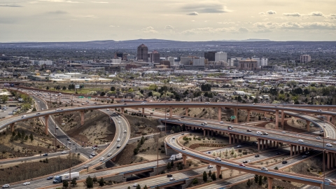 Downtown Albuquerque seen from freeway interchange traffic, New Mexico Aerial Stock Photos | DXP002_126_0003