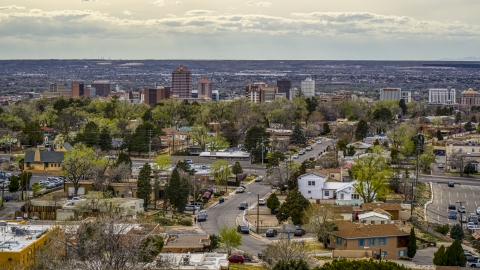 DXP002_126_0006 - Aerial stock photo of A wide view of city's high-rises seen from houses, Downtown Albuquerque, New Mexico