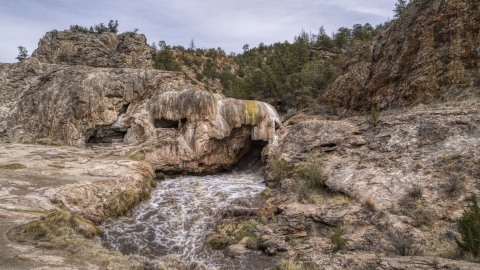 A view of rapids flowing through a rock formation in the mountains of New Mexico Aerial Stock Photos | DXP002_129_0002