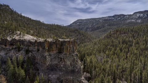 The side of a rock formation in the mountains in New Mexico Aerial Stock Photos | DXP002_129_0009