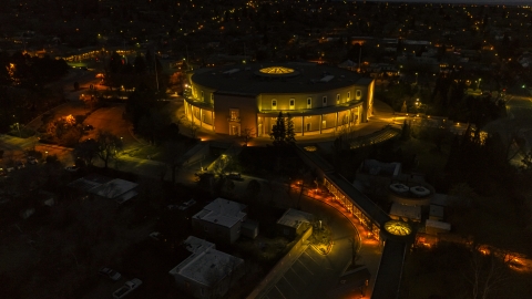 DXP002_132_0006 - Aerial stock photo of The New Mexico State Capitol at night, Santa Fe, New Mexico