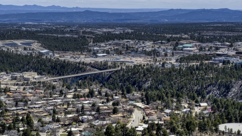 DXP002_133_0015 - Aerial stock photo of A bridge spanning the canyon to the Los Alamos National Laboratory complex, New Mexico