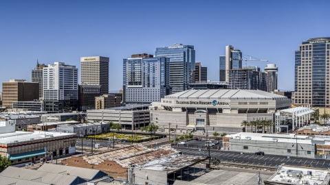 DXP002_136_0001 - Aerial stock photo of An arena near office buildings in Downtown Phoenix, Arizona