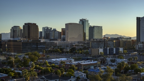 A hotel and high-rise office buildings at sunset in Downtown Phoenix, Arizona Aerial Stock Photos | DXP002_138_0011