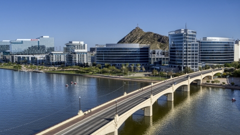 Modern office buildings near a bridge over a reservoir in Tempe, Arizona Aerial Stock Photos | DXP002_142_0006