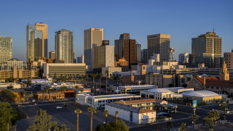 DXP002_143_0005 - Aerial stock photo of Tall buildings in the city's skyline of Downtown Phoenix, Arizona, sunset