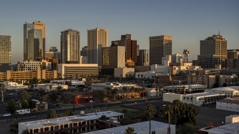 DXP002_143_0006 - Aerial stock photo of A view of the tall office buildings in the city's skyline at sunset, Downtown Phoenix, Arizona