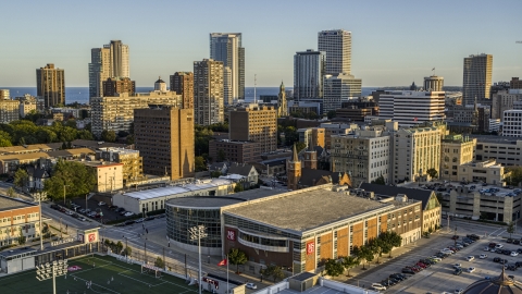 DXP002_150_0001 - Aerial stock photo of The skyline seen from college campus at sunset in Downtown Milwaukee, Wisconsin