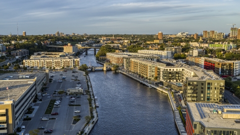 DXP002_150_0002 - Aerial stock photo of Apartment complexes by the Milwaukee River at sunset, Milwaukee, Wisconsin