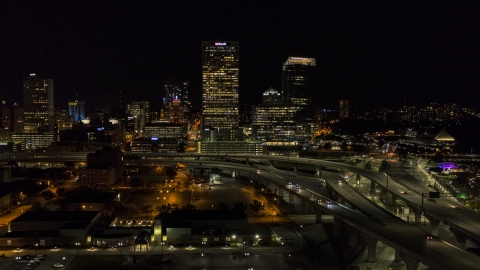 DXP002_151_0004 - Aerial stock photo of A view of downtown buildings and skyscrapers at night, Downtown Milwaukee, Wisconsin