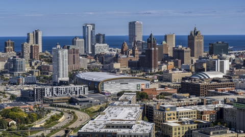 DXP002_152_0001 - Aerial stock photo of The city's skyline in Downtown Milwaukee, Wisconsin, seen from industrial buildings