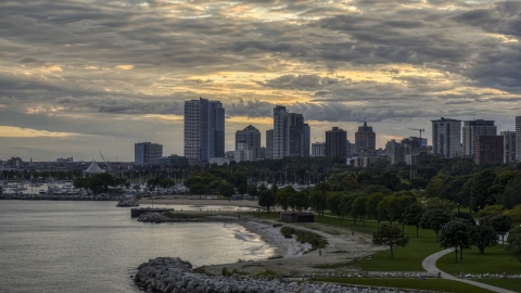 DXP002_155_0002 - Aerial stock photo of A beach and the city's skyline at twilight, Downtown Milwaukee, Wisconsin