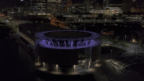 DXP002_157_0004 - Aerial stock photo of Close-up view of Discovery World museum at night, Downtown Milwaukee, Wisconsin