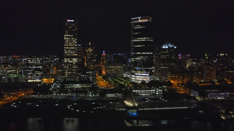 DXP002_157_0005 - Aerial stock photo of The lakefront museum and skyscrapers at night, Downtown Milwaukee, Wisconsin