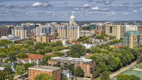 A view of apartment buildings near the capitol dome in Madison, Wisconsin Aerial Stock Photos | DXP002_158_0002